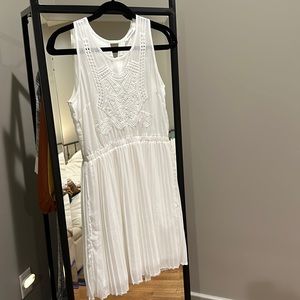 Sleeveless white embroidered dress